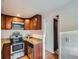 Well-organized kitchen with stainless steel appliances, granite countertops, and plenty of storage at 530 S Ames St, Lakewood, CO 80226
