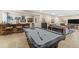 Finished basement featuring a pool table, bar area, and a spacious lounging area at 6999 S Tempe Ct, Aurora, CO 80016