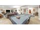 Finished basement featuring a pool table, lounge area with comfortable sofas at 6999 S Tempe Ct, Aurora, CO 80016