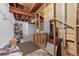Unfinished basement with exposed beams and electrical, offering potential for customization and expansion at 6999 S Tempe Ct, Aurora, CO 80016