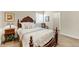 Bedroom showcasing dark wood furniture, a plush bed and warm lighting, creating a cozy retreat at 6999 S Tempe Ct, Aurora, CO 80016