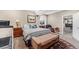 Spacious bedroom featuring carpet, neutral colored walls, and stylish furnishings for a comfortable living space at 6999 S Tempe Ct, Aurora, CO 80016