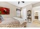 Bedroom with cozy design elements, carpeted floor, and an ensuite bathroom at 6999 S Tempe Ct, Aurora, CO 80016