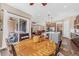Open floor plan with the dining area leading to the kitchen and living room, great for entertaining at 6999 S Tempe Ct, Aurora, CO 80016