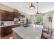 Bright kitchen featuring a large center island, stainless steel appliances, and ample counter space at 6999 S Tempe Ct, Aurora, CO 80016