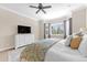 Serene main bedroom with soft lighting and a large window offers a peaceful place to rest and unwind at 6999 S Tempe Ct, Aurora, CO 80016