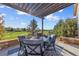 Outdoor patio featuring shaded seating, an open view and a well-maintained landscape, ideal for relaxation at 6999 S Tempe Ct, Aurora, CO 80016