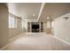 Spacious finished basement featuring built-in shelving, recessed lighting, and neutral carpet at 7099 Cerney Cir, Castle Pines, CO 80108
