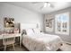 Cozy bedroom with comfortable bed, playful decor, and ample natural light at 7099 Cerney Cir, Castle Pines, CO 80108