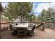 Relaxing outdoor deck offers plenty of space for dining and entertaining at 7099 Cerney Cir, Castle Pines, CO 80108