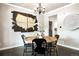 Charming dining room with unique artwork and stylish light fixture at 7099 Cerney Cir, Castle Pines, CO 80108