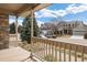 Inviting covered front porch provides a cozy spot to enjoy the outdoors at 7099 Cerney Cir, Castle Pines, CO 80108