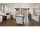 Bright and airy kitchen with stainless steel appliances and an open floor plan at 7099 Cerney Cir, Castle Pines, CO 80108