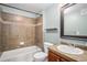 Bathroom featuring tiled shower and flooring, vanity sink and toilet at 9039 E Panorama Cir # C201, Englewood, CO 80112