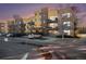 Attractive condo building featuring multiple balconies and a convenient parking area in front at 9039 E Panorama Cir # C201, Englewood, CO 80112