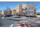 Attractive condo building featuring multiple balconies and a convenient parking area in front at 9039 E Panorama Cir # C201, Englewood, CO 80112