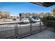 Exterior view from patio with a view of the street and complex parking lot at 9039 E Panorama Cir # C201, Englewood, CO 80112