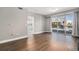 Spacious living room with hardwood floors and sliding glass doors to the balcony for plenty of sunlight at 9039 E Panorama Cir # C201, Englewood, CO 80112