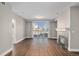 Spacious living room with hardwood floors and sliding glass doors to the balcony, with a fireplace at 9039 E Panorama Cir # C201, Englewood, CO 80112