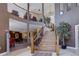 Inviting lobby with a staircase, second floor view, and seating at 9039 E Panorama Cir # C201, Englewood, CO 80112