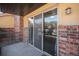 Cozy patio with brick accents and sliding glass door access, perfect for outdoor enjoyment and indoor-outdoor living at 9039 E Panorama Cir # C201, Englewood, CO 80112