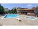 Community pool with a spa and plenty of lounge chairs for relaxation and enjoying the sun at 9039 E Panorama Cir # C201, Englewood, CO 80112