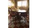 Inviting dining area with wooden table, chairs, and cozy vintage decor at 10504 Jackson Creek Rd, Sedalia, CO 80135