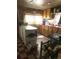 Functional kitchen featuring ample storage, countertop space, and a rustic stove at 10504 Jackson Creek Rd, Sedalia, CO 80135