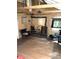 Comfortable living room area with wood floors, wood-burning stove, and cozy seating at 10504 Jackson Creek Rd, Sedalia, CO 80135