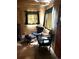 Cozy living room with comfortable seating, wood walls, and rustic style at 10504 Jackson Creek Rd, Sedalia, CO 80135