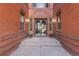 Elegant entrance with brick walls, step stones and double glass doors, with planters on each side at 1475 N Humboldt St # 22, Denver, CO 80218