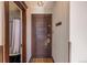 Apartment entrance with a dark wood door and a glimpse into the bathroom, with vintage charm at 1475 N Humboldt St # 22, Denver, CO 80218