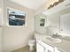 Well-lit bathroom with a single sink vanity and a large mirror at 5005 W 128Th Pl, Broomfield, CO 80020