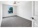 Bright bedroom with new carpet, large window, and a fresh coat of white paint at 5005 W 128Th Pl, Broomfield, CO 80020