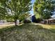 Charming home exterior with mature trees, lush lawn, and a well-maintained landscape at 5005 W 128Th Pl, Broomfield, CO 80020