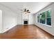 Spacious living room featuring a fireplace, hardwood floors, and large windows at 5005 W 128Th Pl, Broomfield, CO 80020