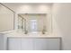 Bathroom with double vanity, large mirror and glass shower at 15267 Fillmore St, Thornton, CO 80602