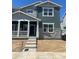 Charming two-story home with a covered porch, stone accents, and a modern design in a Gathering-friendly neighborhood at 15267 Fillmore St, Thornton, CO 80602