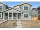 Charming two-story home with a covered front porch and stone accents at 15267 Fillmore St, Thornton, CO 80602