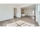 Bright living space with wood-look floors, many windows and an open layout at 15267 Fillmore St, Thornton, CO 80602