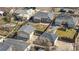 Drone shot displaying the house with its fenced backyard, garage, and overall lot size in a residential area at 4563 W 34Th Ave, Denver, CO 80212