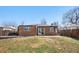 Brick home exterior with cozy backyard and patio area at 4563 W 34Th Ave, Denver, CO 80212
