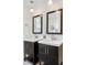 Modern bathroom with double vanities, dark wood cabinets, and contemporary mirrors and lighting at 4563 W 34Th Ave, Denver, CO 80212