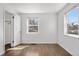 Bright bedroom featuring wood floors and lots of natural light from two windows at 4563 W 34Th Ave, Denver, CO 80212