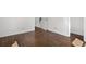 Hardwood flooring, white trim, and an electrical outlet are featured in this light-filled space at 4563 W 34Th Ave, Denver, CO 80212
