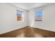Charming bedroom with hardwood floors and dual windows allowing ample natural light at 4563 W 34Th Ave, Denver, CO 80212