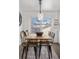 Cozy dining area with a wooden table, eclectic chairs, and bright natural light at 4563 W 34Th Ave, Denver, CO 80212