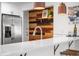 Close-up of a modern kitchen with marble countertops and stainless steel appliances at 4563 W 34Th Ave, Denver, CO 80212