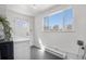 Bright laundry room with modern appliances, shelving and door leading to exterior at 4563 W 34Th Ave, Denver, CO 80212