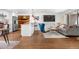 Bright living area with hardwood floors, a modern kitchen with a breakfast bar, and a comfortable seating area at 4563 W 34Th Ave, Denver, CO 80212